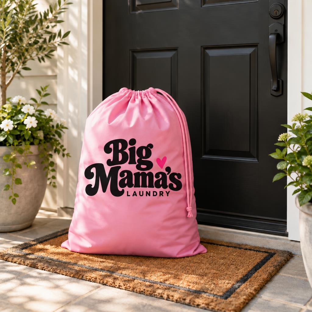 Pink Big Mama's Laundry bag waiting at a front door